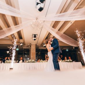 low angle photography of bride and groom dancing